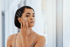 Really, Vaseline as a Moisturizer? - Woman applying moisturizer