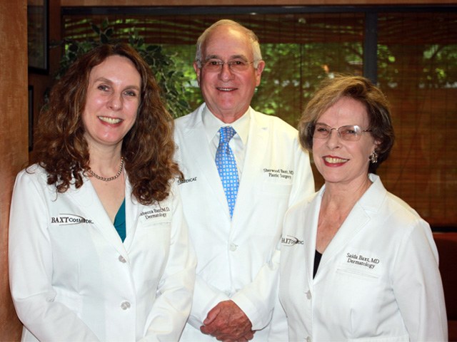 A photo of Dr. Rebecca Baxt, Dr. Sherwood Baxt & Dr. Saida Baxt standing together